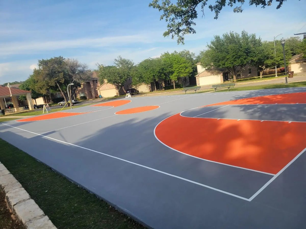 Freshly striped ADA accessible parking spaces with handicap stencils in a San Antonio commercial lot striped by Lonestar Construction Industries